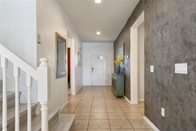 8801 Macapa Dr, Kissimmee, FL 34747 - corridor featuring stairs, light tile patterned floors, baseboards, and recessed lighting