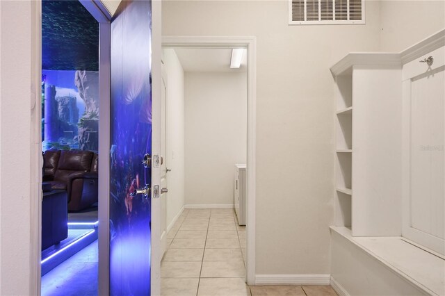 8801 Macapa Dr, Kissimmee, FL 34747 - mudroom with tile patterned flooring and baseboards