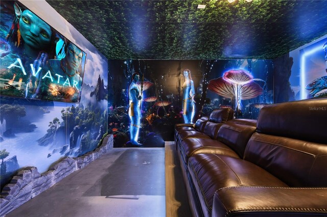 8801 Macapa Dr, Kissimmee, FL 34747 - home theater room featuring concrete flooring