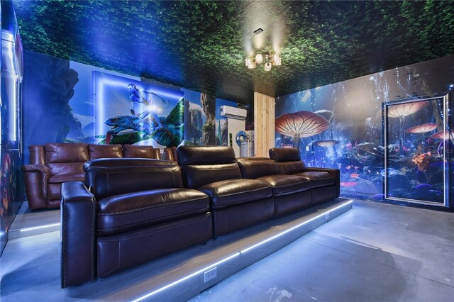 8801 Macapa Dr, Kissimmee, FL 34747 - home theater room with a wall unit AC and finished concrete floors