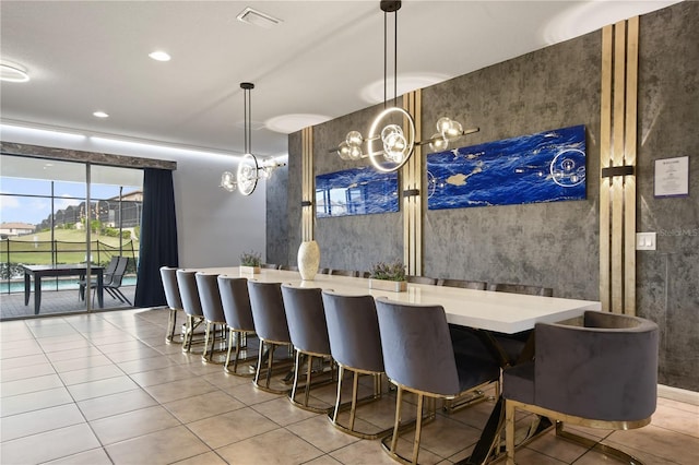 8801 Macapa Dr, Kissimmee, FL 34747 - tiled dining room with recessed lighting