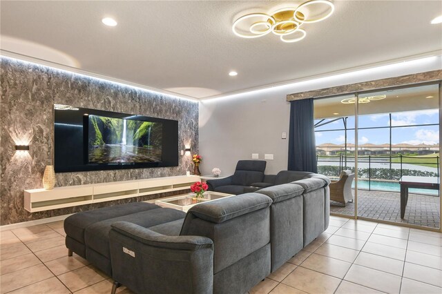 8801 Macapa Dr, Kissimmee, FL 34747 - cinema with light tile patterned floors, recessed lighting, and a chandelier