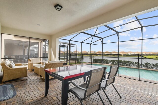 8801 Macapa Dr, Kissimmee, FL 34747 - view of patio / terrace featuring an outdoor pool, glass enclosure, and outdoor lounge area