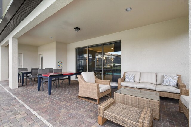 8801 Macapa Dr, Kissimmee, FL 34747 - view of patio featuring outdoor lounge area and outdoor dining space
