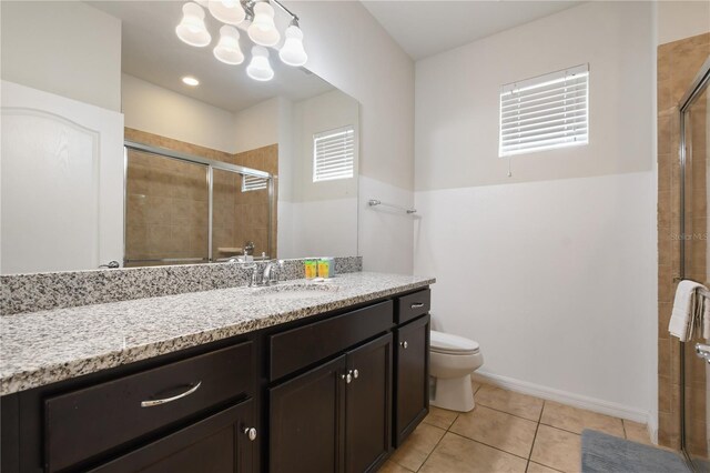 8801 Macapa Dr, Kissimmee, FL 34747 - full bath featuring toilet, vanity, a shower stall, and tile patterned floors