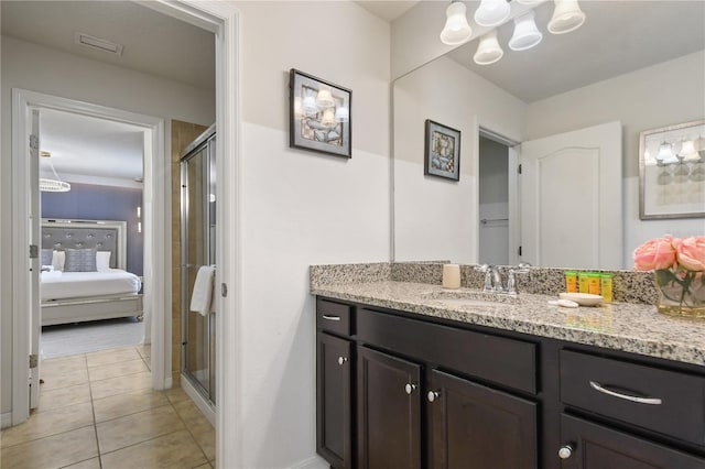 8801 Macapa Dr, Kissimmee, FL 34747 - bathroom with vanity, a shower stall, ensuite bath, and a chandelier