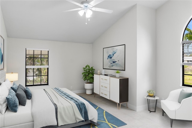 104 Bryant Ct, Sebastian, FL 32958 - bedroom with vaulted ceiling, light tile patterned floors, baseboards, and ceiling fan