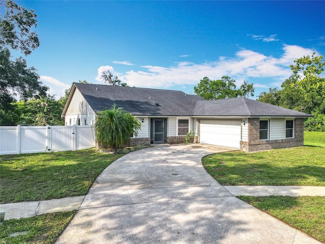 4942 Eden View Ct, Orlando, FL 32810 - ranch-style house featuring a gate, an attached garage, driveway, brick siding, and roof with shingles