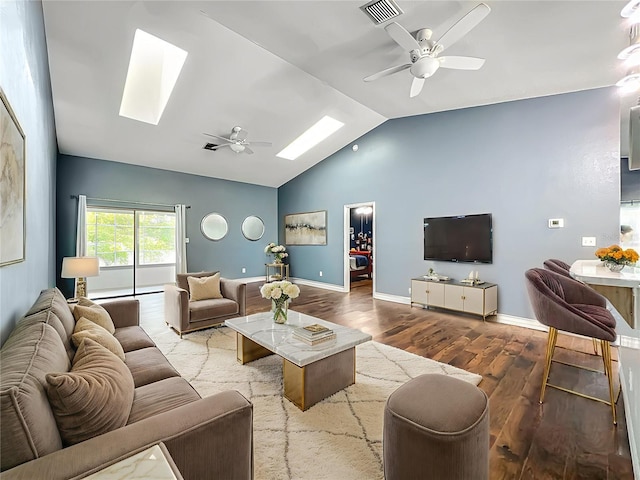 4942 Eden View Ct, Orlando, FL 32810 - living area with a skylight, a ceiling fan, wood finished floors, vaulted ceiling, and baseboards