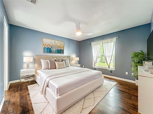 4942 Eden View Ct, Orlando, FL 32810 - bedroom featuring baseboards, dark wood finished floors, and a ceiling fan