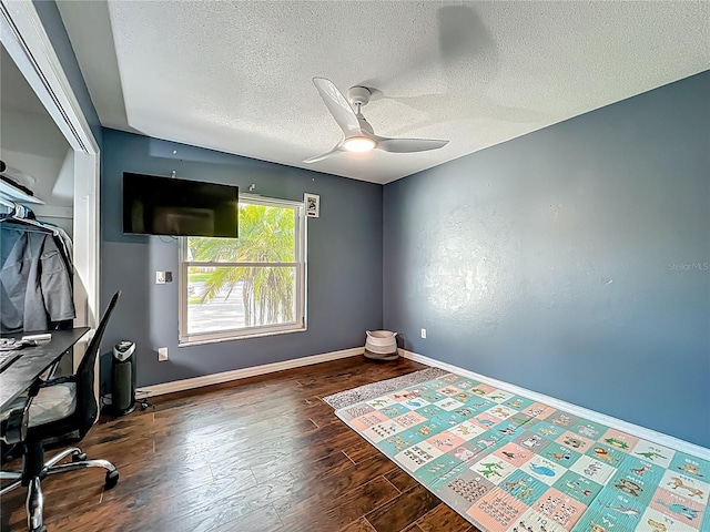 4942 Eden View Ct, Orlando, FL 32810 - unfurnished office with wood finished floors, a textured ceiling, a ceiling fan, and baseboards