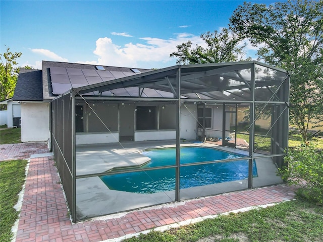 4942 Eden View Ct, Orlando, FL 32810 - swimming pool with a patio and a lanai