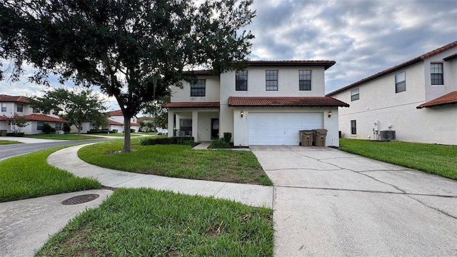 16631 Lazy Breeze Loop, Clermont, FL 34714 - mediterranean / spanish home with stucco siding, driveway, a front lawn, and an attached garage