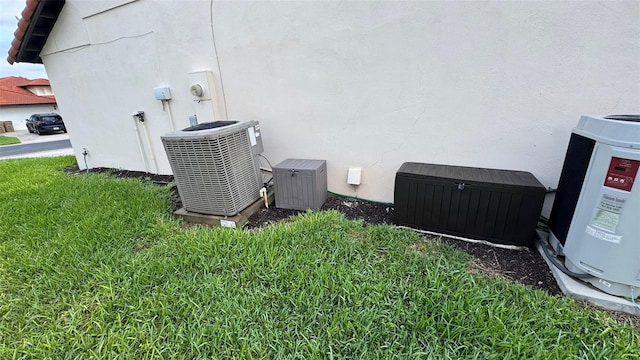 16631 Lazy Breeze Loop, Clermont, FL 34714 - exterior view of cooling unit, stucco siding, and electric meter