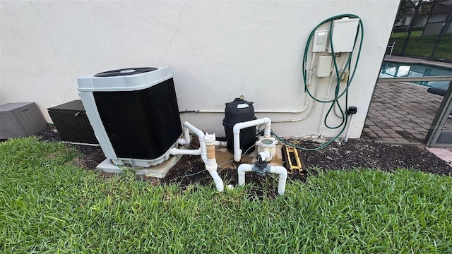 16631 Lazy Breeze Loop, Clermont, FL 34714 - exterior view of stucco siding, central AC unit, and a swimming pool