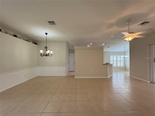 541 Arena Dr, Davenport, FL 33837 - unfurnished room featuring a chandelier, recessed lighting, light tile patterned floors, a ceiling fan, and a decorative wall