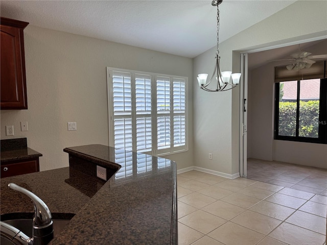 541 Arena Dr, Davenport, FL 33837 - kitchen with light tile patterned floors, a chandelier, a ceiling fan, hanging light fixtures, and a sink