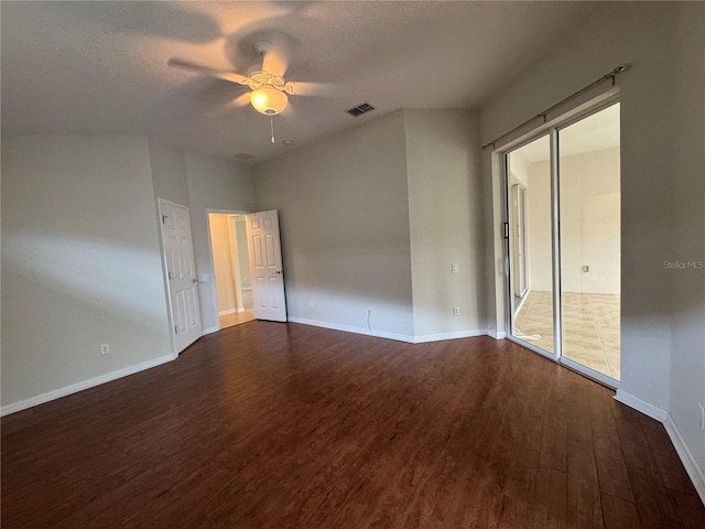 541 Arena Dr, Davenport, FL 33837 - spare room with wood finished floors, ceiling fan, baseboards, and a textured ceiling