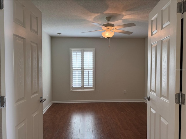 541 Arena Dr, Davenport, FL 33837 - spare room with ceiling fan, baseboards, dark wood-style flooring, and a textured ceiling