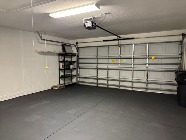 541 Arena Dr, Davenport, FL 33837 - garage featuring a garage door opener and concrete block wall