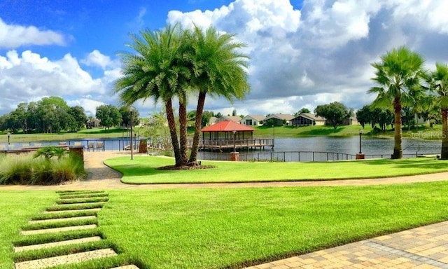 541 Arena Dr, Davenport, FL 33837 - view of home's community with a gazebo, a water view, and a lawn