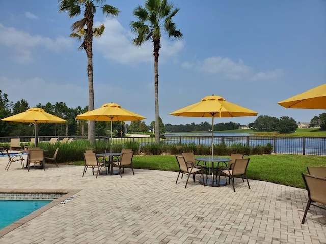 541 Arena Dr, Davenport, FL 33837 - view of patio / terrace with a water view and outdoor dining space
