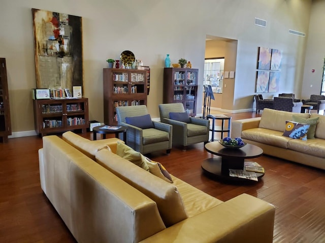 541 Arena Dr, Davenport, FL 33837 - living area with wood finished floors, baseboards, and a high ceiling