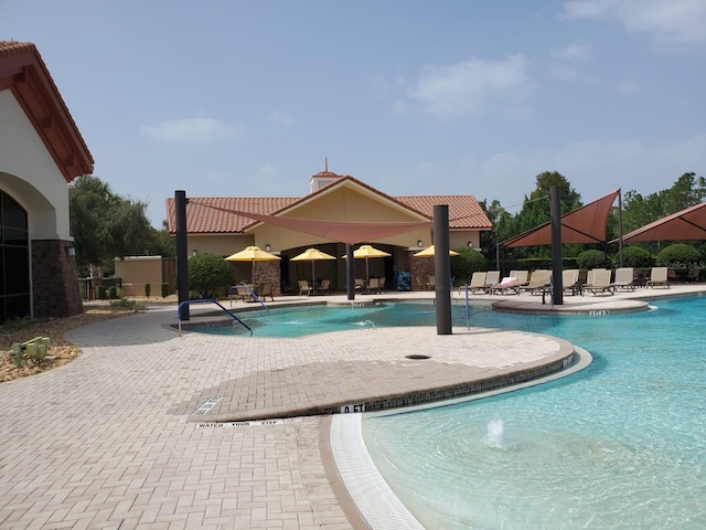 541 Arena Dr, Davenport, FL 33837 - community pool featuring a patio