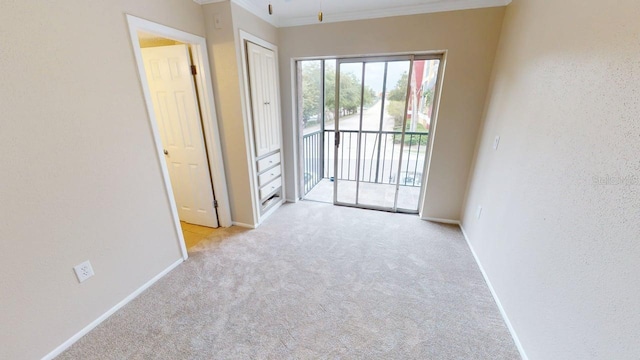 145 Oyster Bay Cir Unit 200, Altamonte Springs, FL 32701 - empty room featuring ornamental molding, baseboards, and carpet