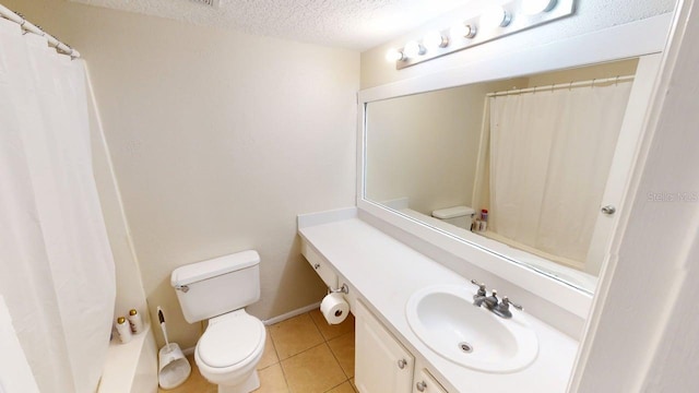 145 Oyster Bay Cir Unit 200, Altamonte Springs, FL 32701 - full bath with toilet, vanity, a textured ceiling, tile patterned flooring, and a shower with curtain