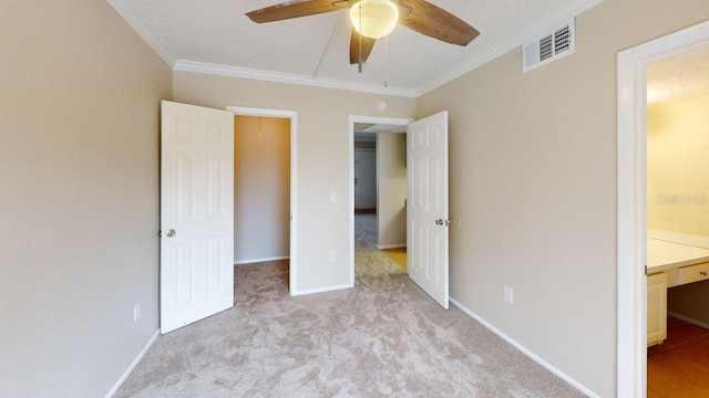 145 Oyster Bay Cir Unit 200, Altamonte Springs, FL 32701 - unfurnished bedroom featuring crown molding, carpet flooring, connected bathroom, baseboards, and a ceiling fan