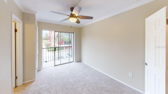 145 Oyster Bay Cir Unit 200, Altamonte Springs, FL 32701 - spare room featuring light colored carpet, a ceiling fan, a textured ceiling, baseboards, and ornamental molding
