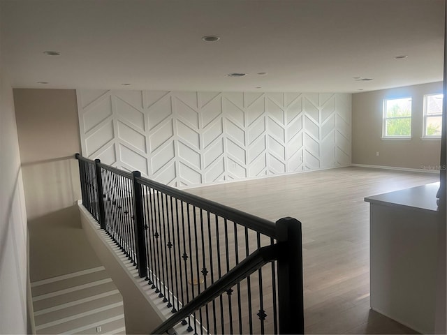 4413 Lions Gate Ave, Clermont, FL 34711 - corridor featuring wood finished floors, an upstairs landing, and recessed lighting