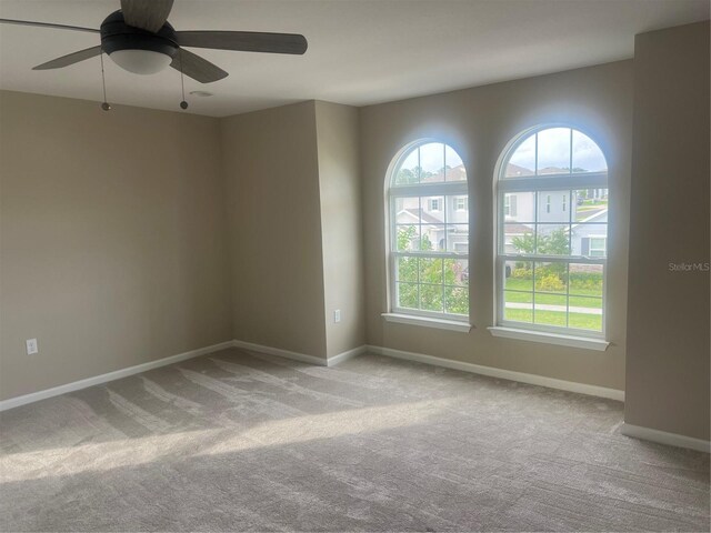 4413 Lions Gate Ave, Clermont, FL 34711 - unfurnished room featuring carpet flooring and a ceiling fan