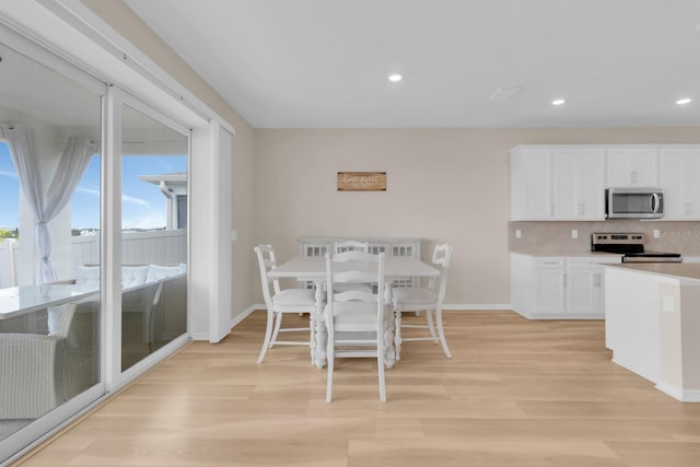 7639 Agrigento St, Clermont, FL 34714 - dining space with light wood-type flooring and recessed lighting