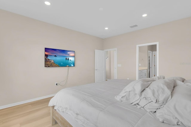 7639 Agrigento St, Clermont, FL 34714 - bedroom with light wood-type flooring, recessed lighting, and ensuite bath