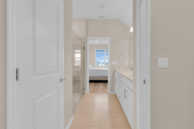 7639 Agrigento St, Clermont, FL 34714 - bathroom featuring a shower stall, vanity, tile patterned flooring, and connected bathroom
