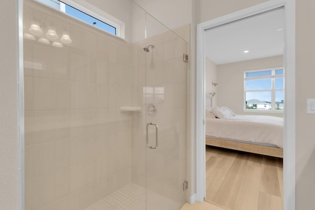 7639 Agrigento St, Clermont, FL 34714 - full bathroom featuring ensuite bath, a shower stall, healthy amount of natural light, and wood finished floors