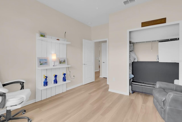 7639 Agrigento St, Clermont, FL 34714 - sitting room featuring wood finished floors and baseboards