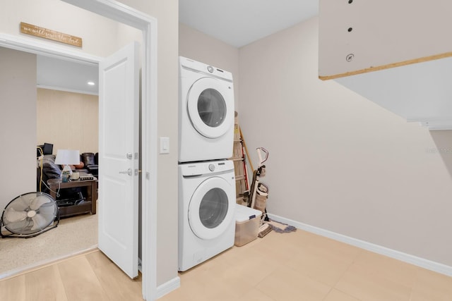 7639 Agrigento St, Clermont, FL 34714 - laundry room with stacked washer / dryer and baseboards