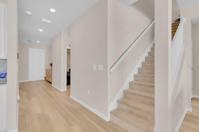 7639 Agrigento St, Clermont, FL 34714 - stairway featuring wood finished floors and recessed lighting