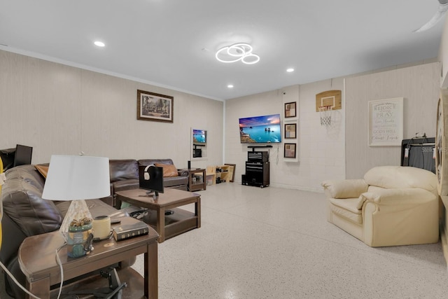 7639 Agrigento St, Clermont, FL 34714 - living room featuring speckle patterned floor, recessed lighting, and crown molding