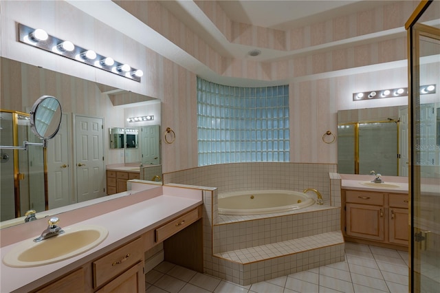 1586 Antoinette Ct, Oviedo, FL 32765 - bathroom featuring wallpapered walls, tile patterned flooring, a garden tub, two vanities, and a stall shower