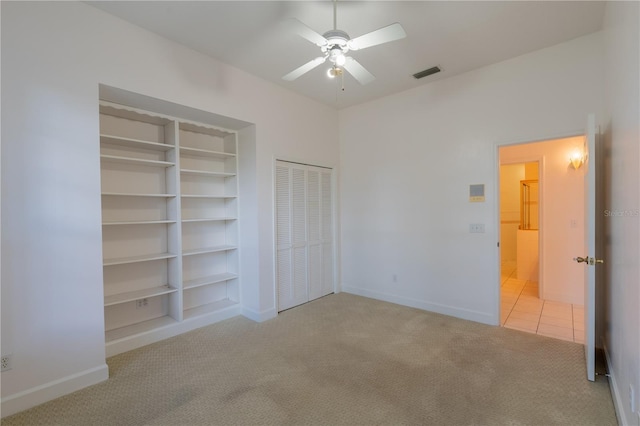 1586 Antoinette Ct, Oviedo, FL 32765 - unfurnished bedroom featuring carpet floors, multiple closets, and tile patterned floors