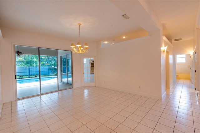 1586 Antoinette Ct, Oviedo, FL 32765 - unfurnished room with light tile patterned floors and a chandelier