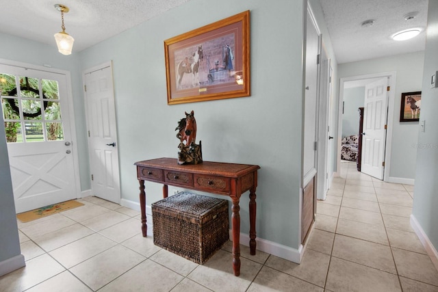 12434 Sullivan Rd, Clermont, FL 34715 - entrance foyer featuring a textured ceiling and light tile patterned floors