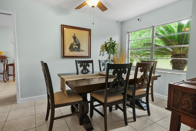 12434 Sullivan Rd, Clermont, FL 34715 - dining space with light tile patterned floors and a ceiling fan