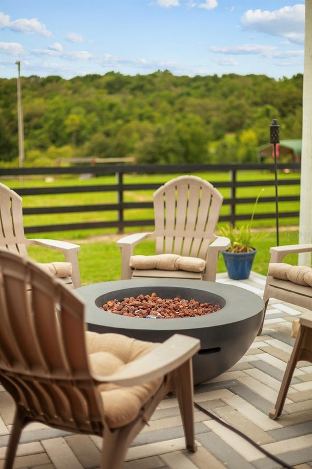 12434 Sullivan Rd, Clermont, FL 34715 - view of patio / terrace with a fire pit