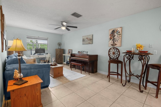 12434 Sullivan Rd, Clermont, FL 34715 - living area featuring ceiling fan, a textured ceiling, and light tile patterned floors
