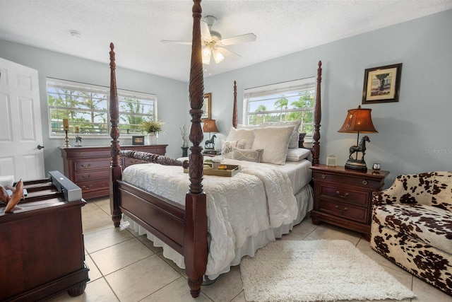 12434 Sullivan Rd, Clermont, FL 34715 - bedroom featuring multiple windows, light tile patterned flooring, ceiling fan, and a textured ceiling